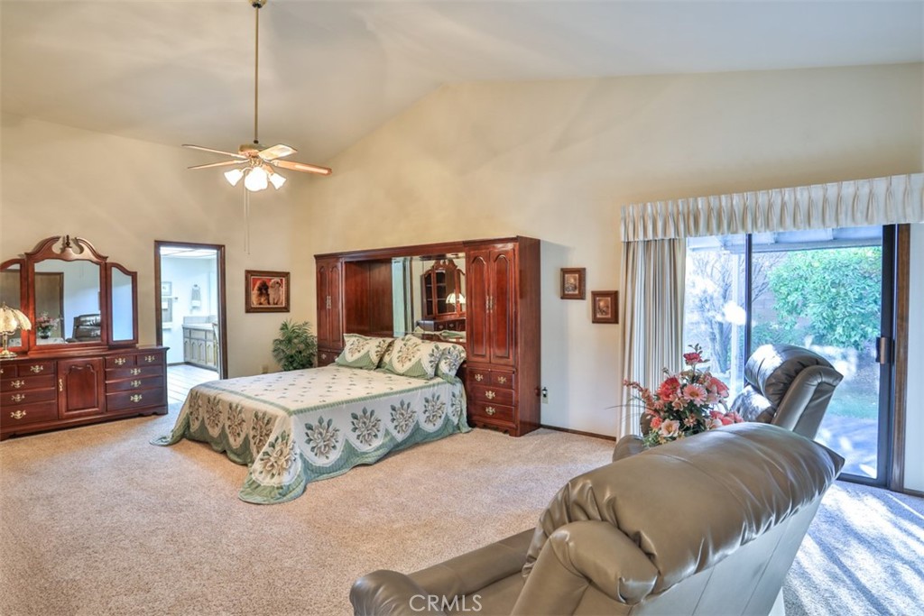 5848 Burlwood Court Rancho Cucamonga, CA 91701 - Photo 48 of 71 a bedroom with a bed and a chandelier