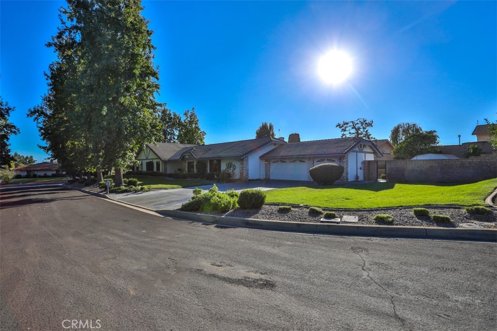 5848 Burlwood Court Rancho Cucamonga, CA 91701 - Photo 6 of 71 a view of a house with a yard