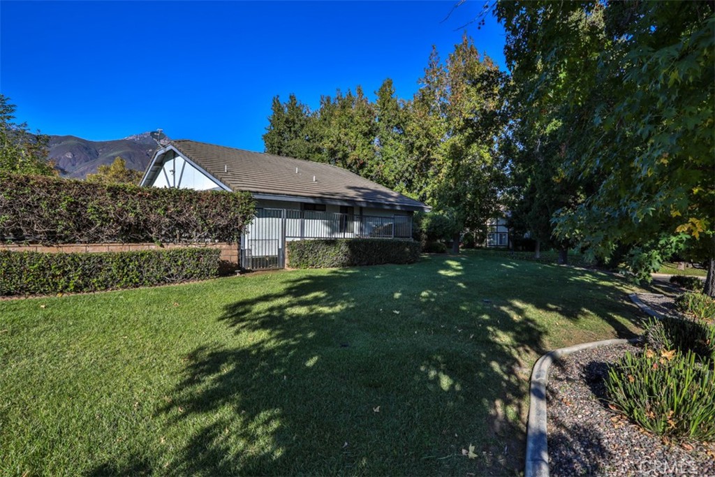 5848 Burlwood Court Rancho Cucamonga, CA 91701 - Photo 10 of 71 a front view of a house with a yard