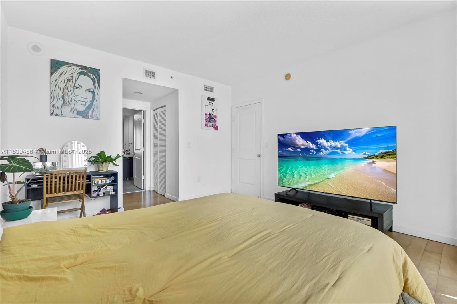 333 Northeast 24th Street, Unit 812 Miami, FL 33137 - Photo 12 of 32 a bedroom with a bed and furniture