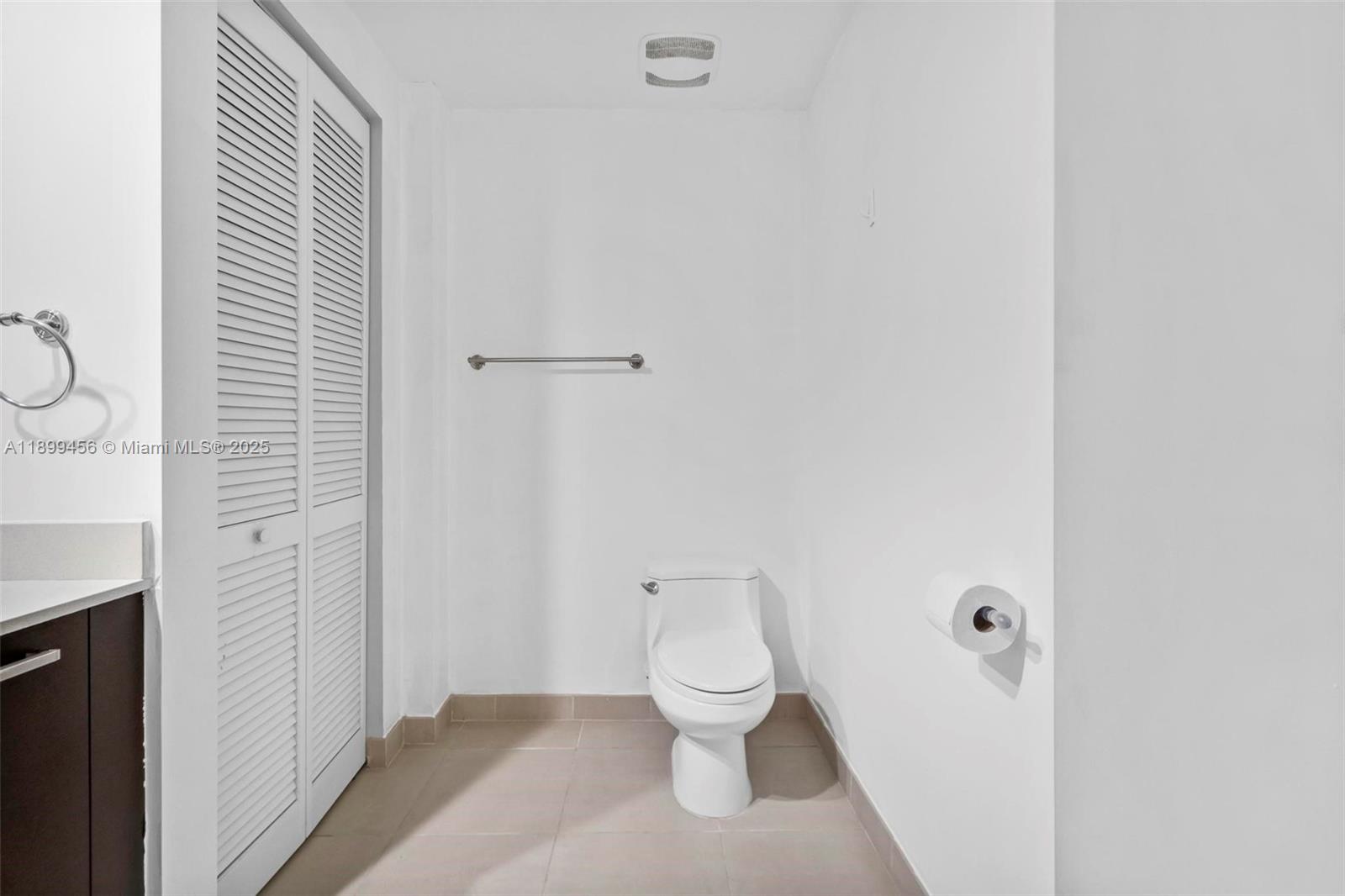 333 Northeast 24th Street, Unit 812 Miami, FL 33137 - Photo 15 of 32 a bathroom with a toilet and a shower