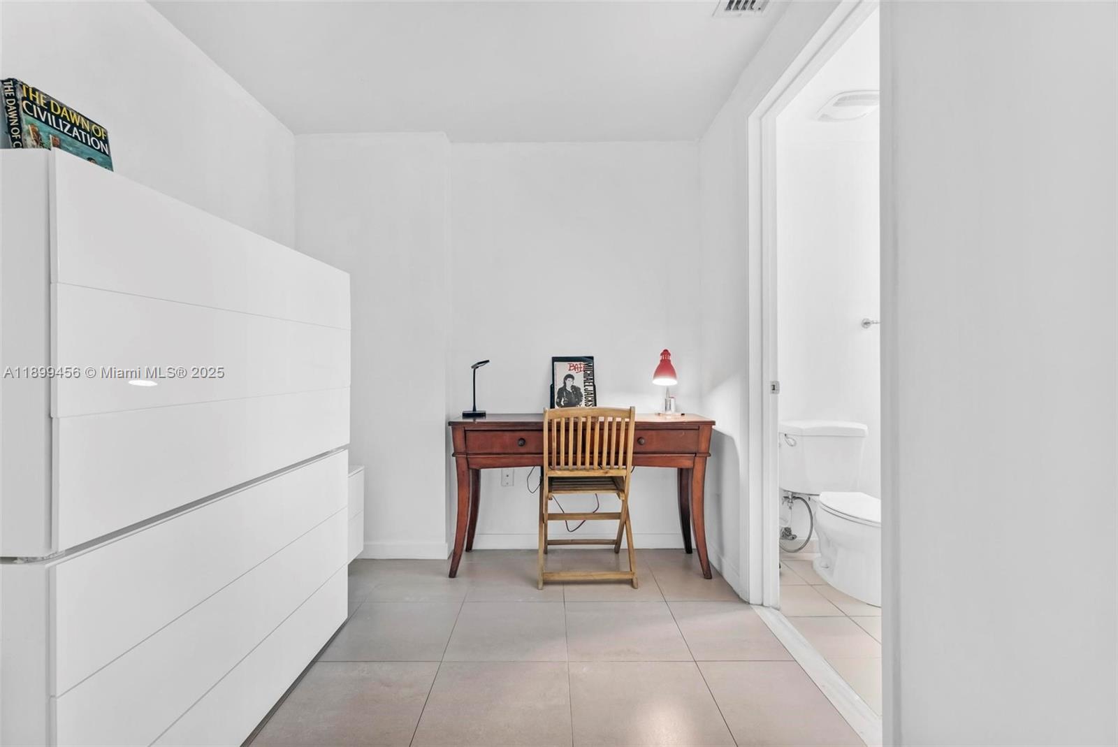 333 Northeast 24th Street, Unit 812 Miami, FL 33137 - Photo 18 of 32 a room with a table and chairs