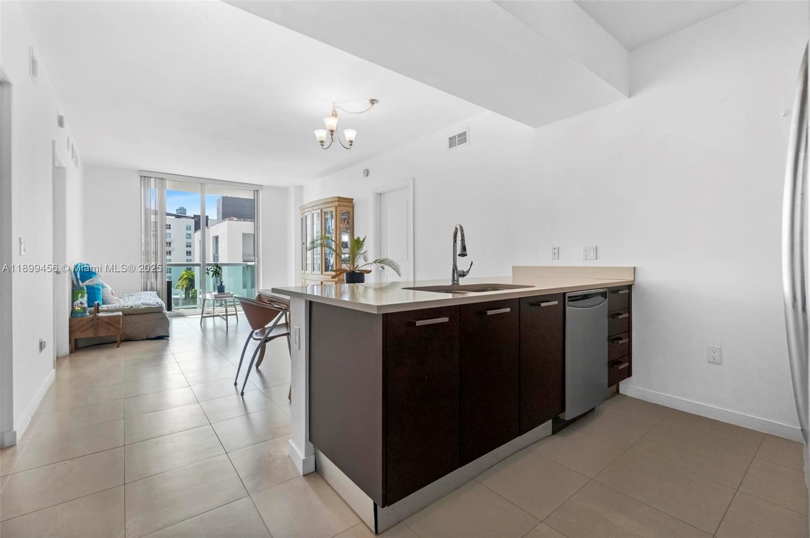 333 Northeast 24th Street, Unit 812 Miami, FL 33137 - Photo 4 of 32 a en suite bathroom with a double vanity sink and a mirror