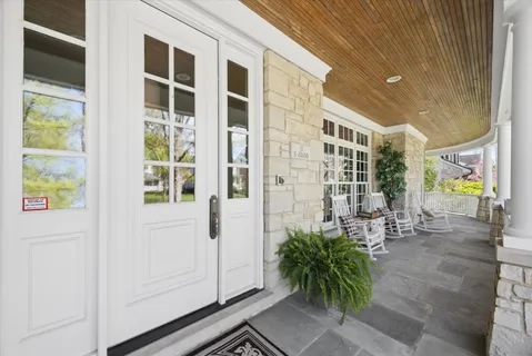 a view of front door and potted plants