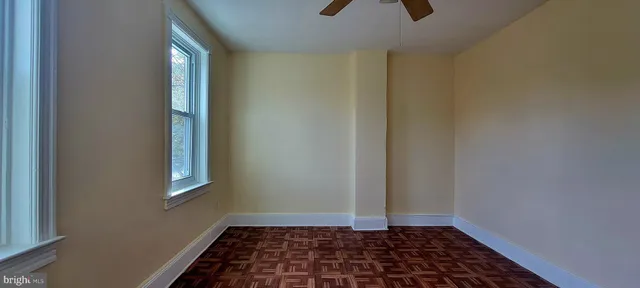 a bathroom with a toilet and a bathtub
