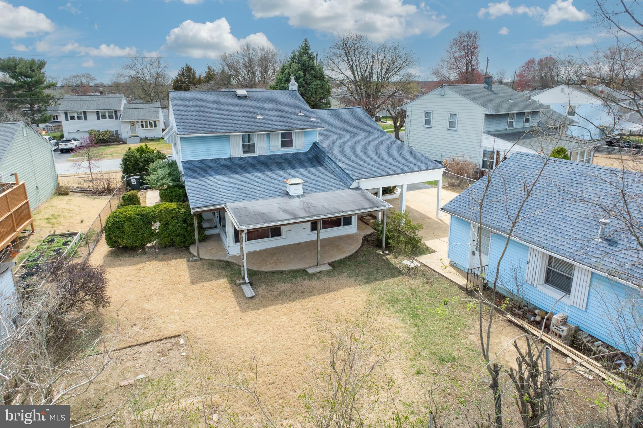 an aerial view of a house with swimming pool