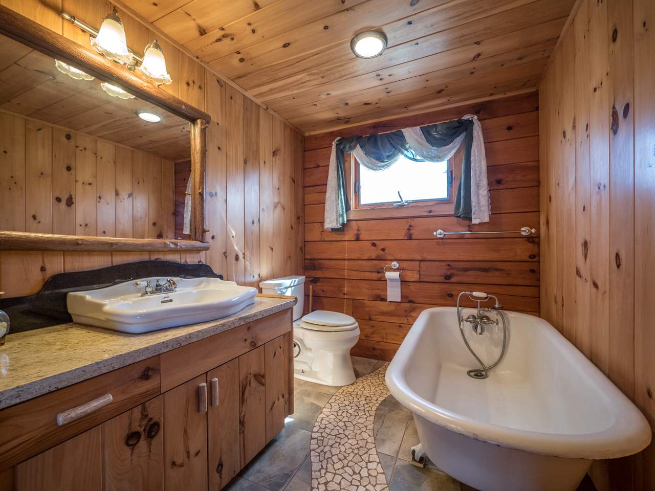 600 Calasa Road Kula, HI 96790 - Photo 13 of 30 a bathroom with a sink and a mirror