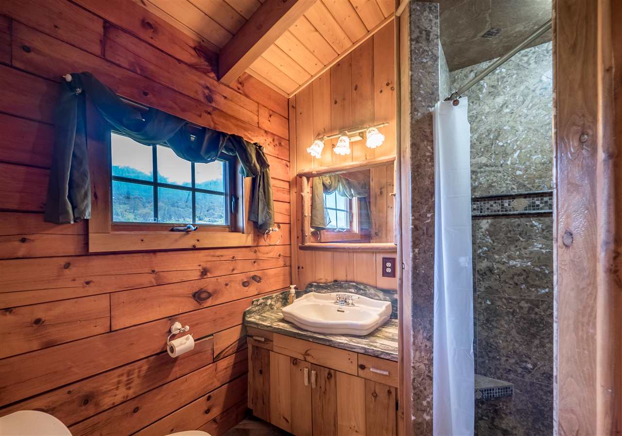 600 Calasa Road Kula, HI 96790 - Photo 20 of 30 a bathroom with a sink and mirror