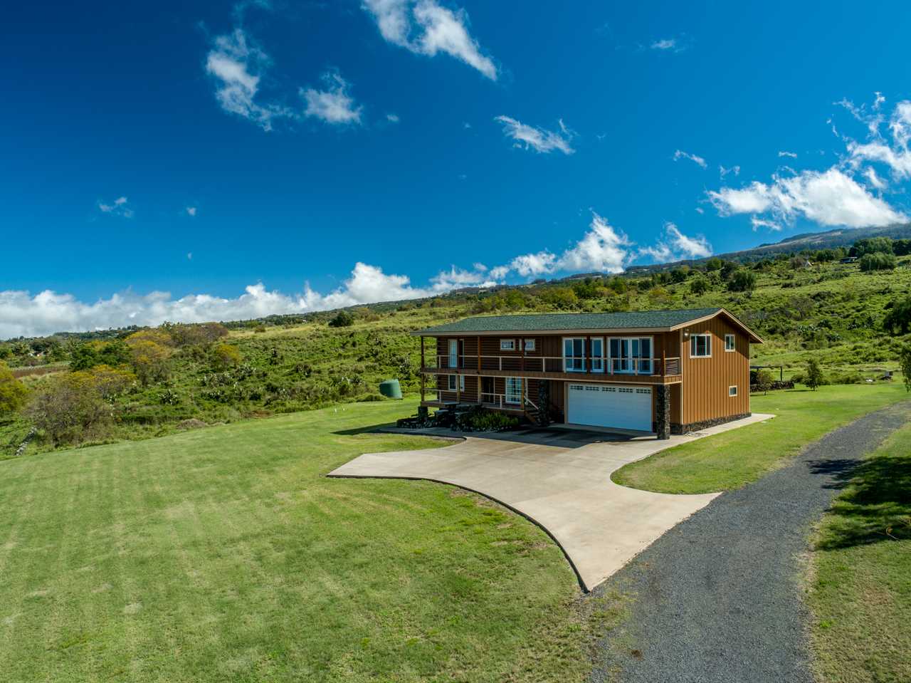 600 Calasa Road Kula, HI 96790 - Photo 2 of 30 a view of a house with a yard porch and sitting area