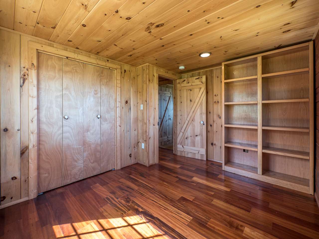 600 Calasa Road Kula, HI 96790 - Photo 21 of 30 a view of an empty room with a window and wooden floor
