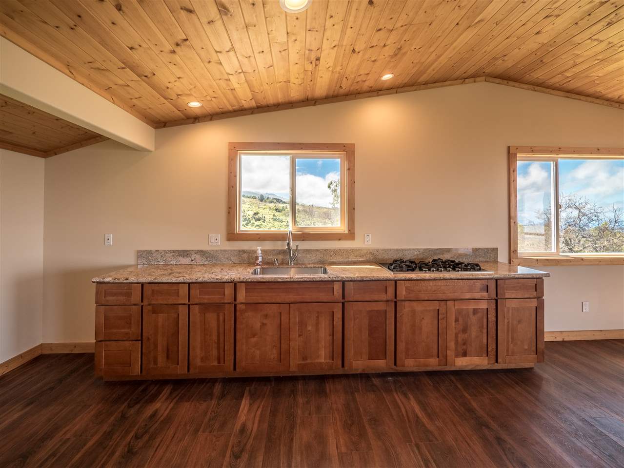 600 Calasa Road Kula, HI 96790 - Photo 25 of 30 a spacious bathroom with a granite countertop tub sink and mirror