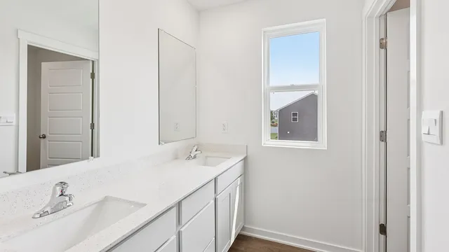 a kitchen with a refrigerator a sink and cabinets
