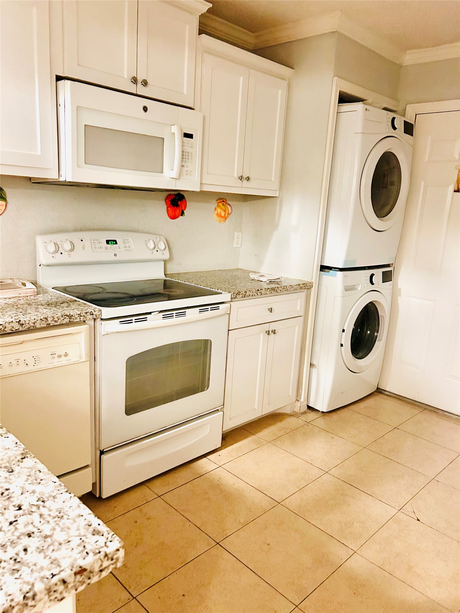11643 Chimney Rock Road, Unit B Houston, TX 77035 - Photo 3 of 9 a kitchen with a stove top oven sink and cabinets