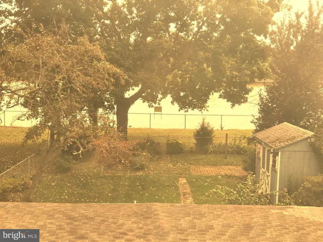 a view of a yard next to a building