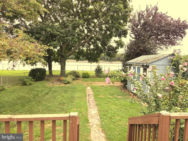 a view of yard with swimming pool