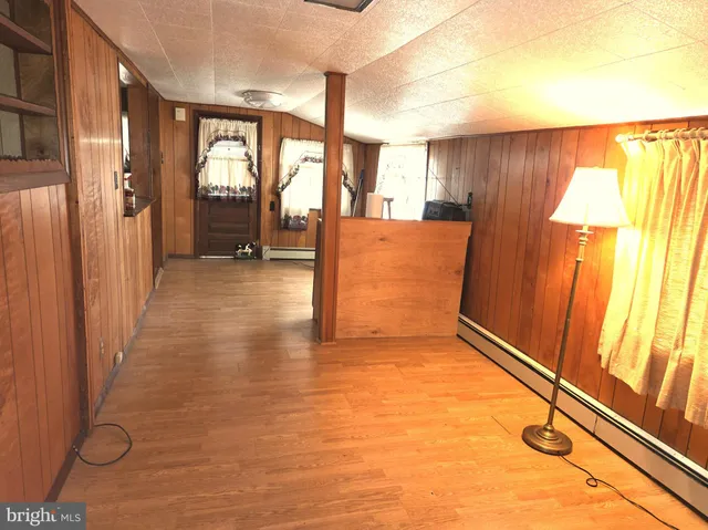a view of a room with window and wooden floor