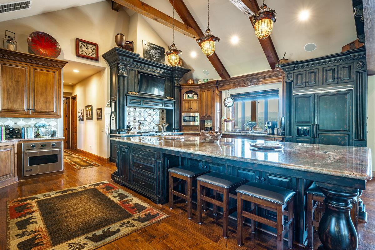 39110 Kearsarge Mill Road Alta, CA 95715 - Photo 35 of 99 a kitchen with stainless steel appliances granite countertop a stove and a sink