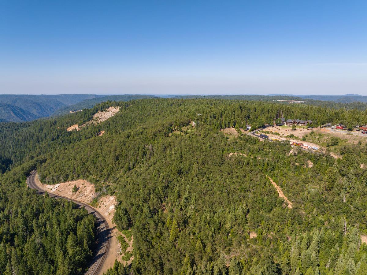 39110 Kearsarge Mill Road Alta, CA 95715 - Photo 4 of 99 a view of a city with lush green forest