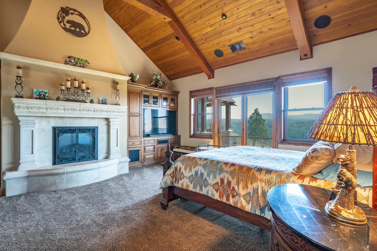 39110 Kearsarge Mill Road Alta, CA 95715 - Photo 52 of 99 a bed sitting in a spacious bedroom next to a window