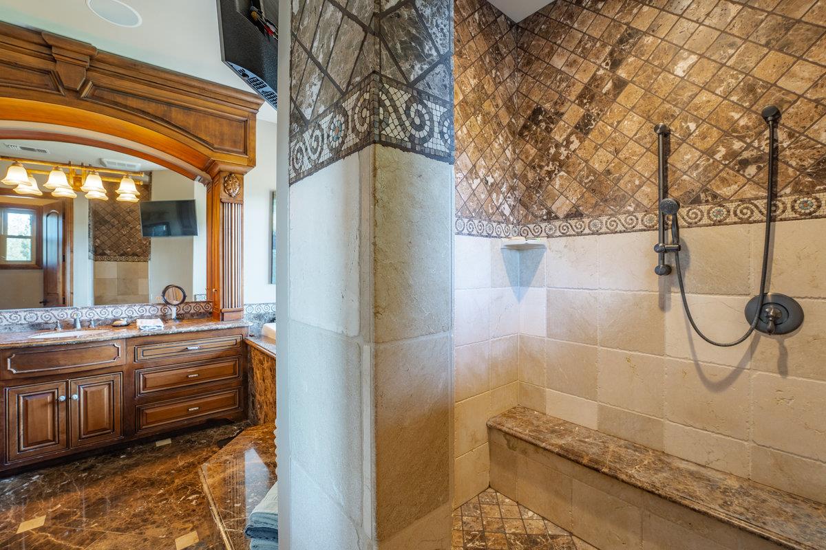 39110 Kearsarge Mill Road Alta, CA 95715 - Photo 55 of 99 a bathroom with a granite countertop shower and a sink