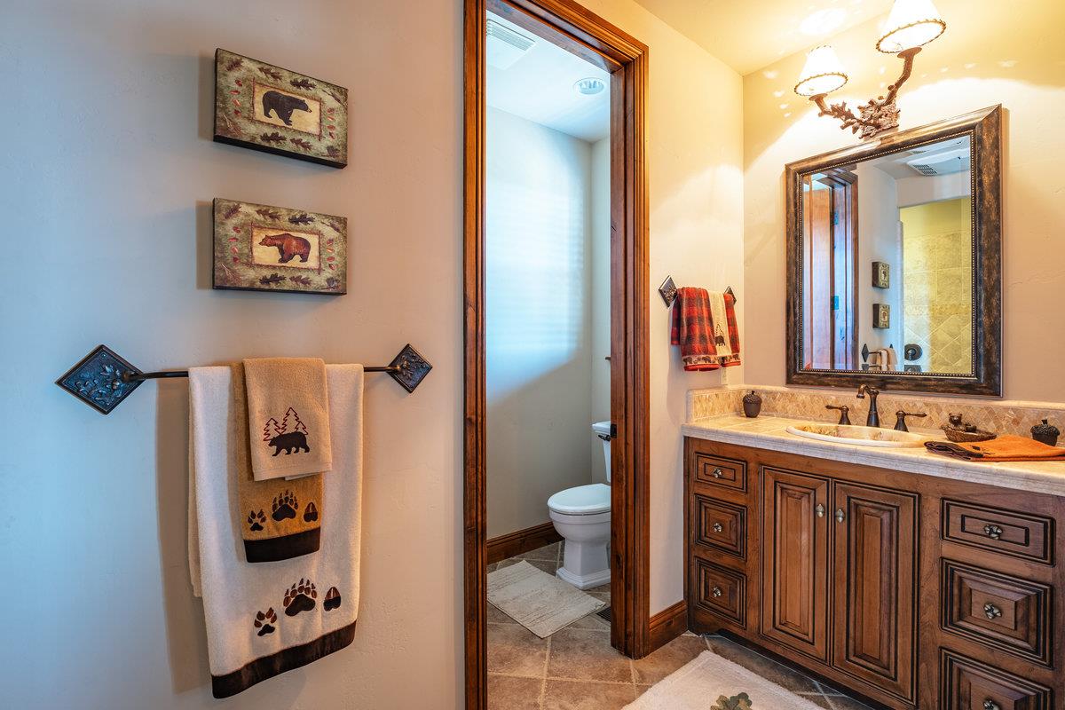 39110 Kearsarge Mill Road Alta, CA 95715 - Photo 60 of 99 a bathroom with a double vanity sink and a mirror