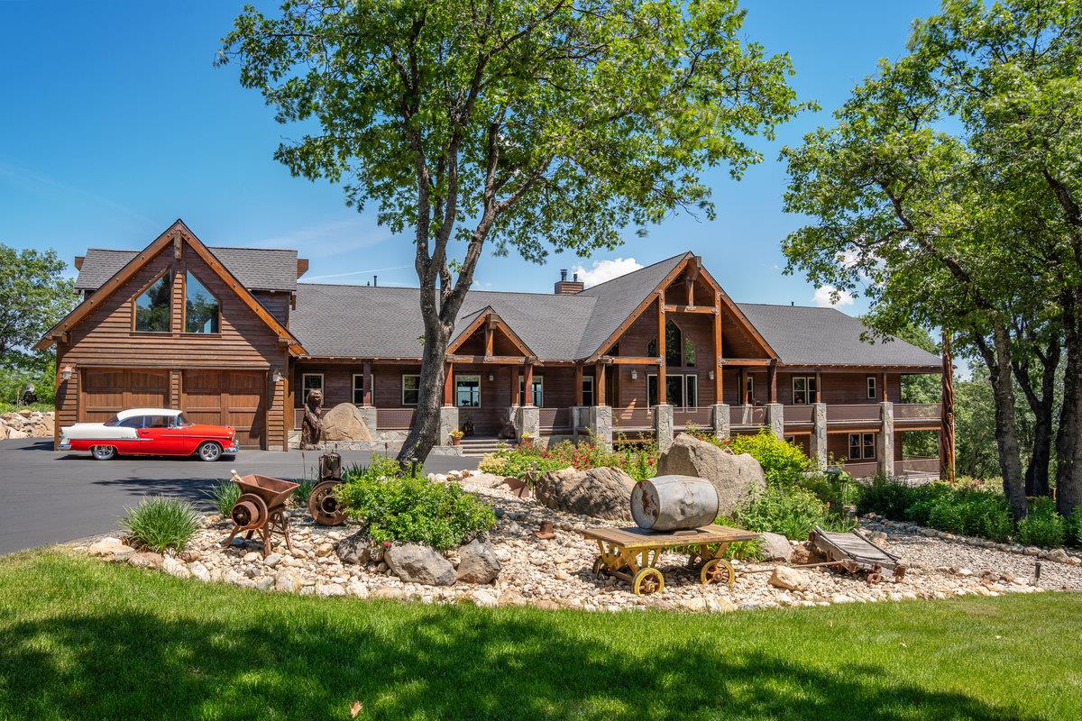 39110 Kearsarge Mill Road Alta, CA 95715 - Photo 83 of 99 a front view of a house with a garden and trees