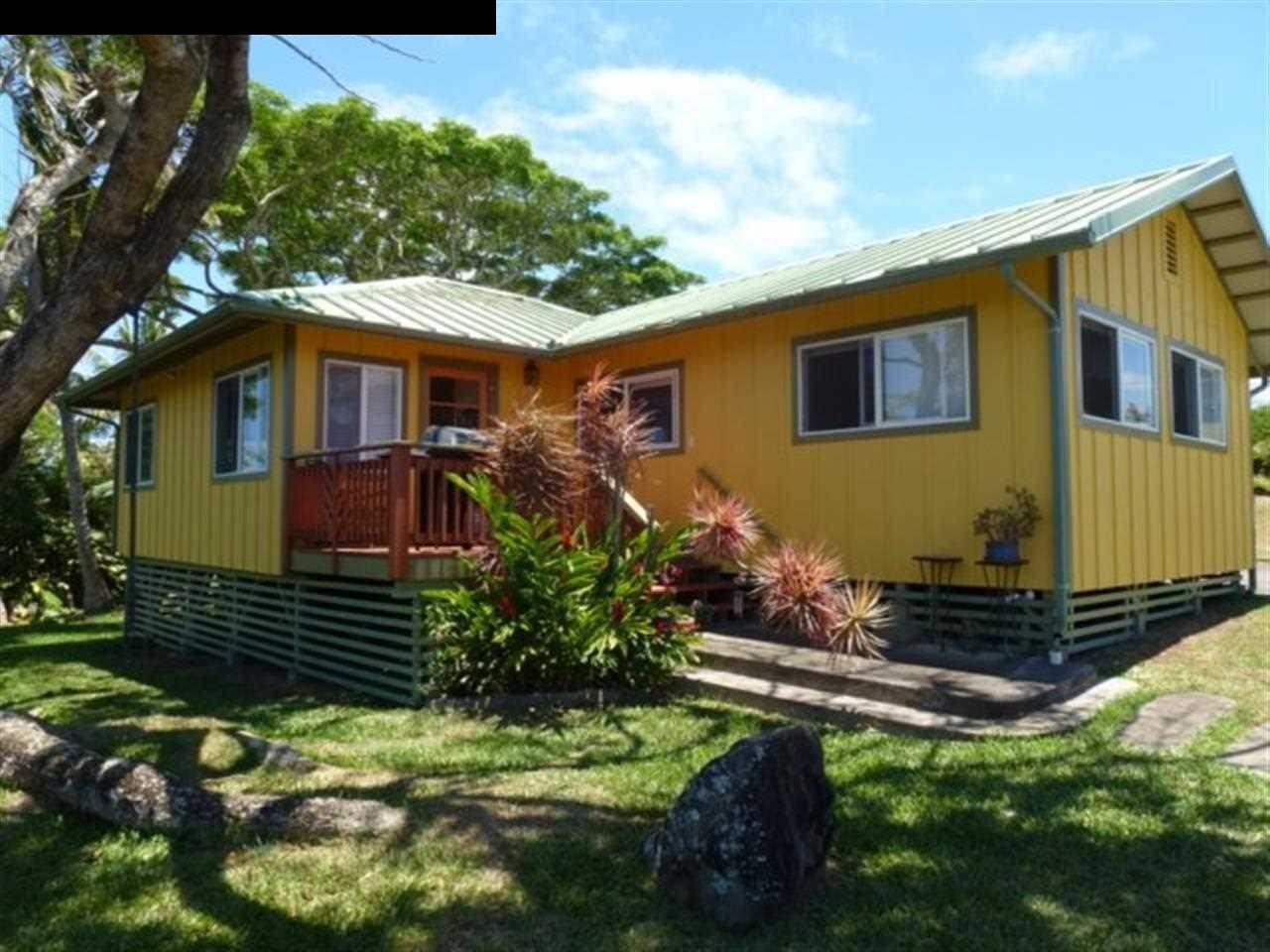 1220 West Kuiaha Road, Unit B1 Haiku, HI 96708 - Photo 1 of 29 a front view of a house with a yard
