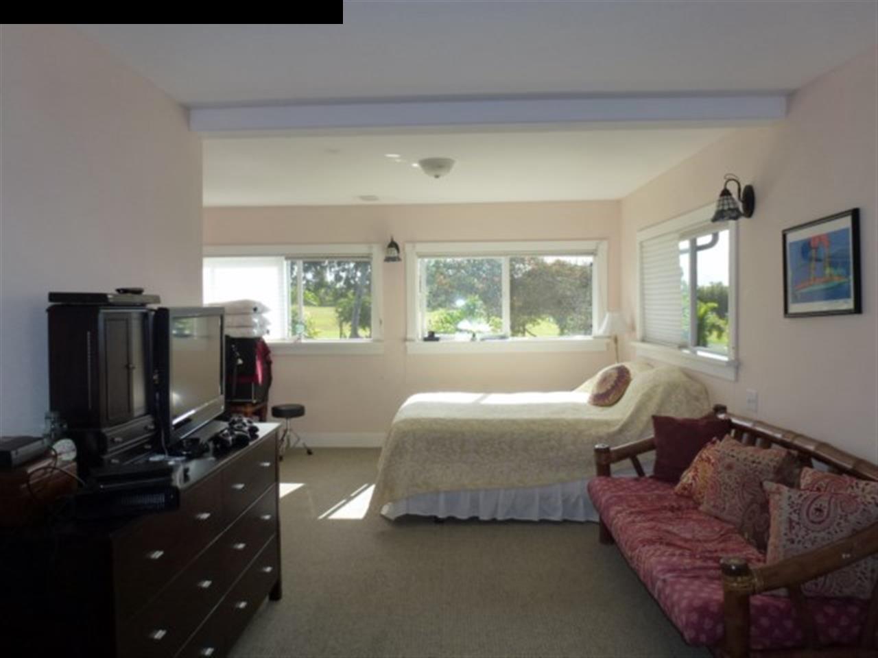 1220 West Kuiaha Road, Unit B1 Haiku, HI 96708 - Photo 11 of 29 a bedroom with bed and window