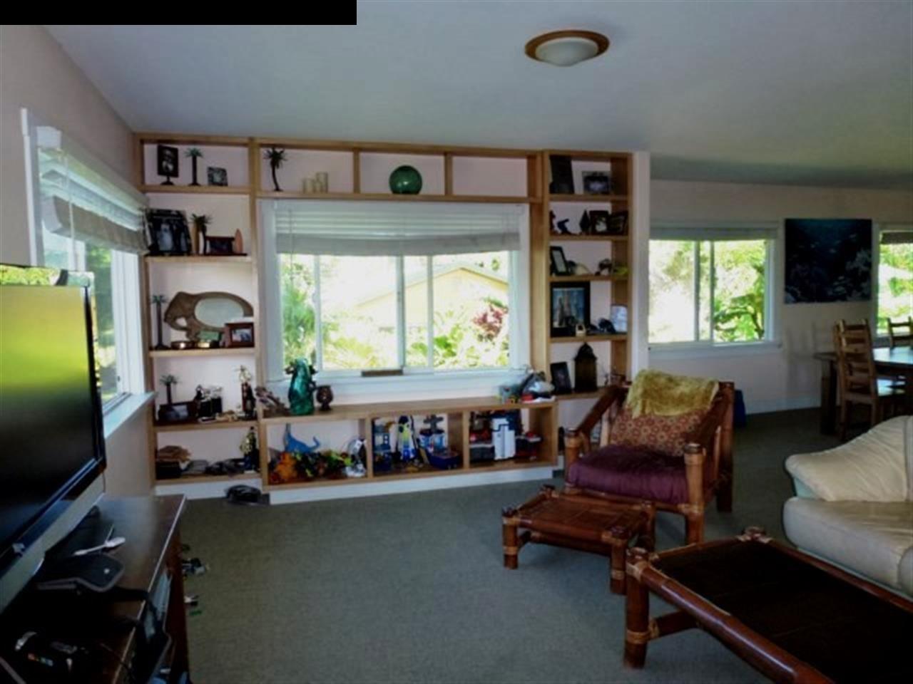 1220 West Kuiaha Road, Unit B1 Haiku, HI 96708 - Photo 14 of 29 a living room with furniture and a flat screen tv
