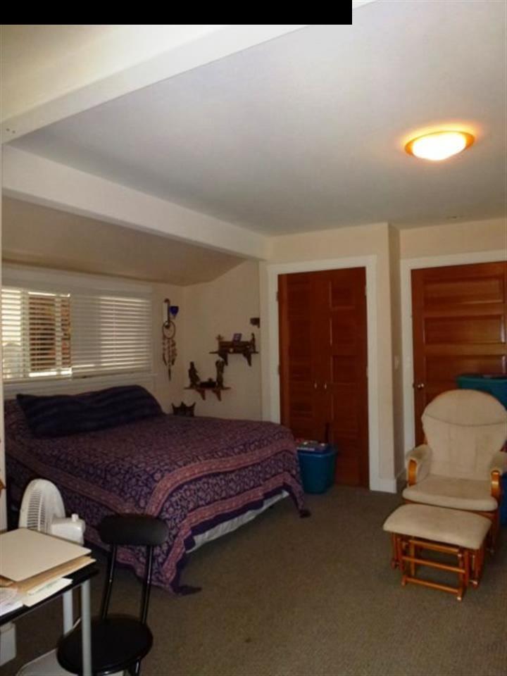 1220 West Kuiaha Road, Unit B1 Haiku, HI 96708 - Photo 16 of 29 a bedroom with a bed and a dresser
