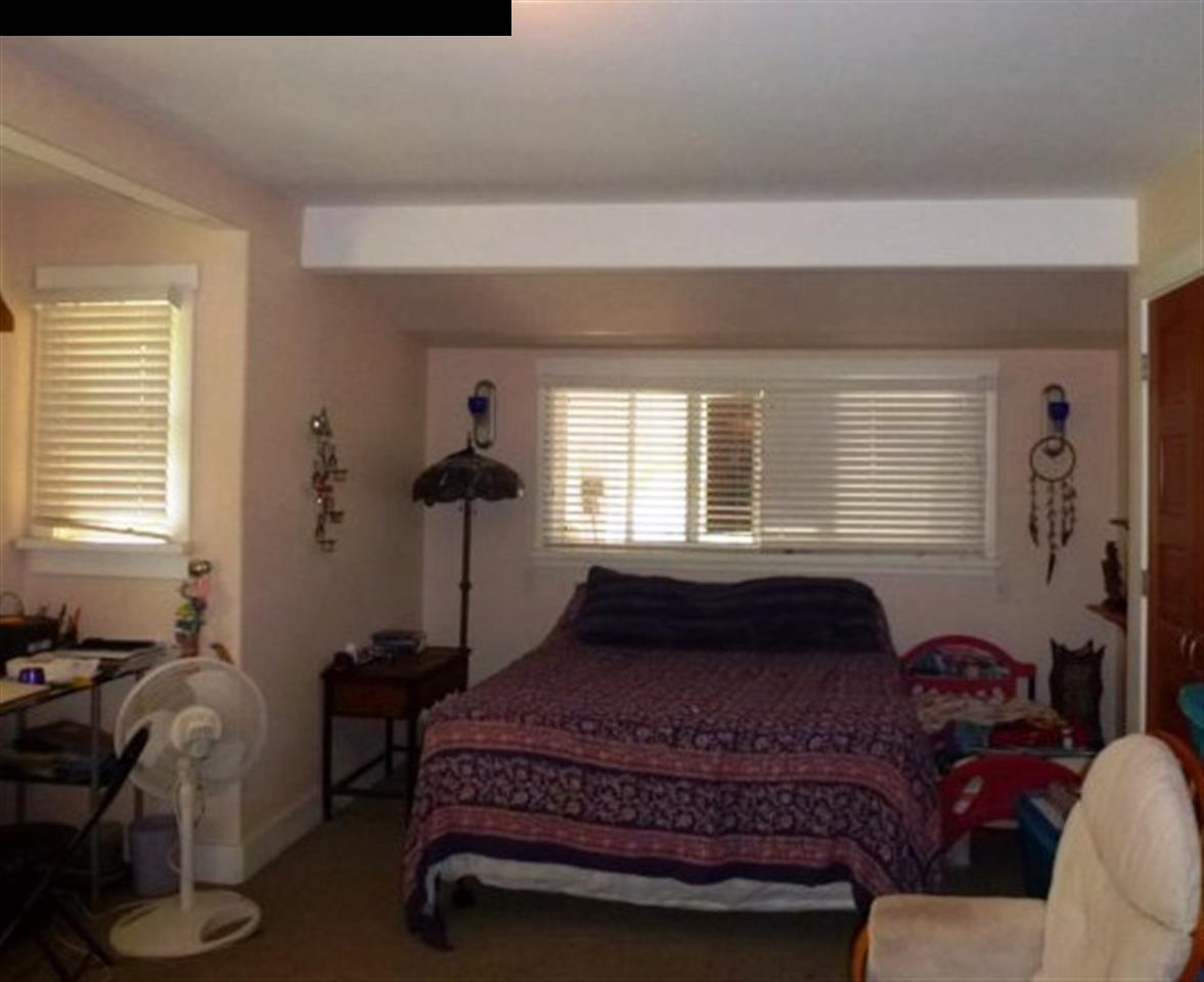 1220 West Kuiaha Road, Unit B1 Haiku, HI 96708 - Photo 17 of 29 a bedroom with a bed and window