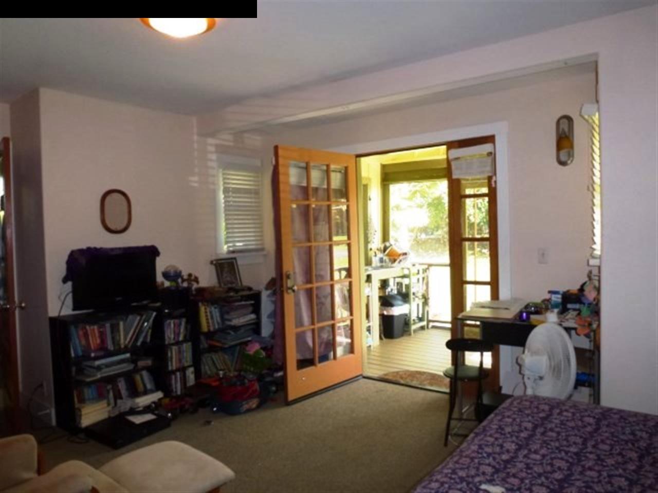 1220 West Kuiaha Road, Unit B1 Haiku, HI 96708 - Photo 18 of 29 a living room with furniture and a window