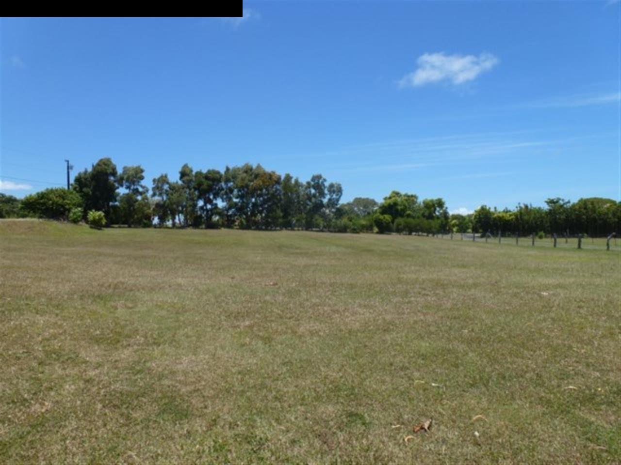 1220 West Kuiaha Road, Unit B1 Haiku, HI 96708 - Photo 20 of 29 a view of a field with an ocean view