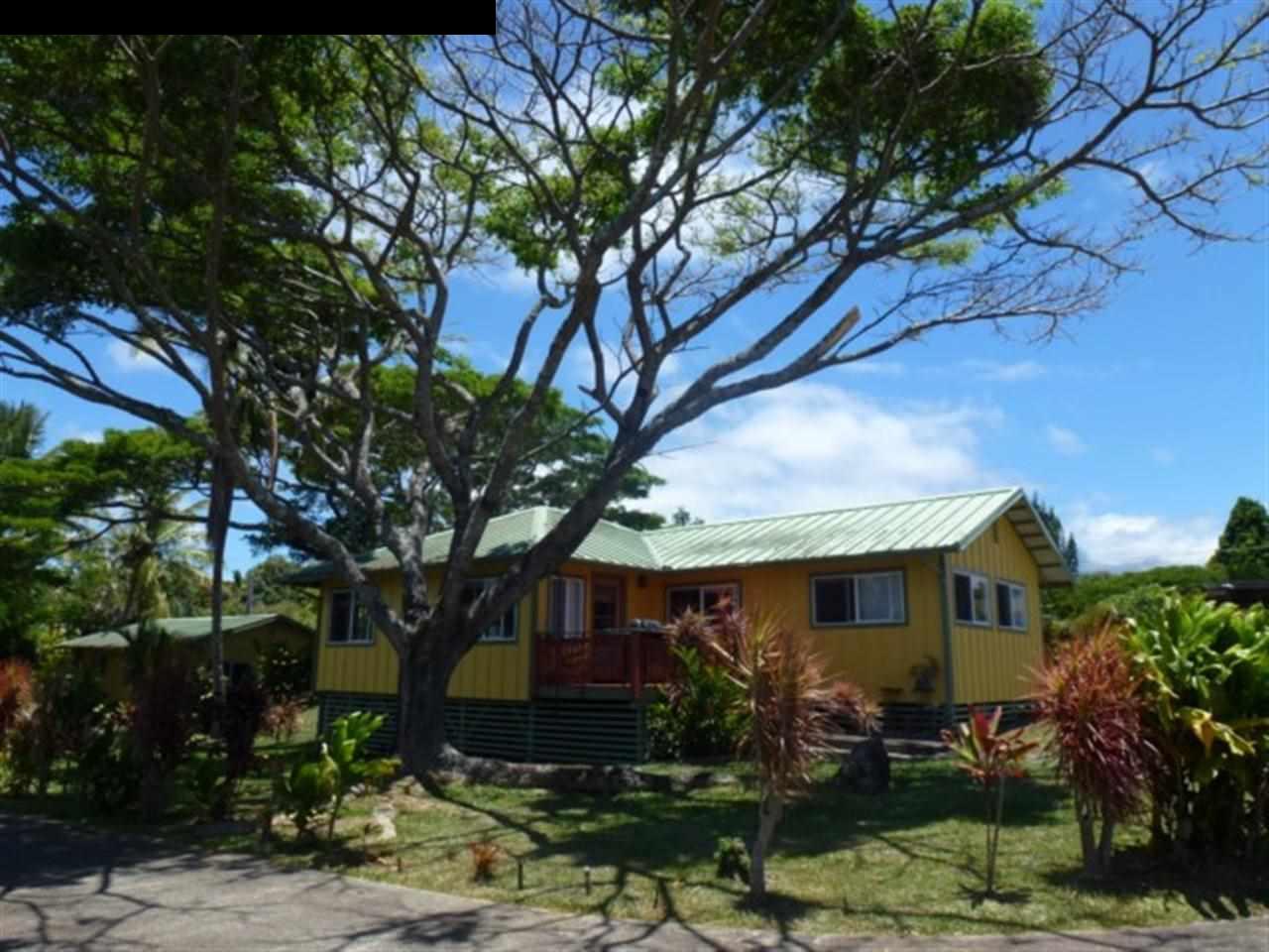 1220 West Kuiaha Road, Unit B1 Haiku, HI 96708 - Photo 2 of 29 a front view of a house with garden