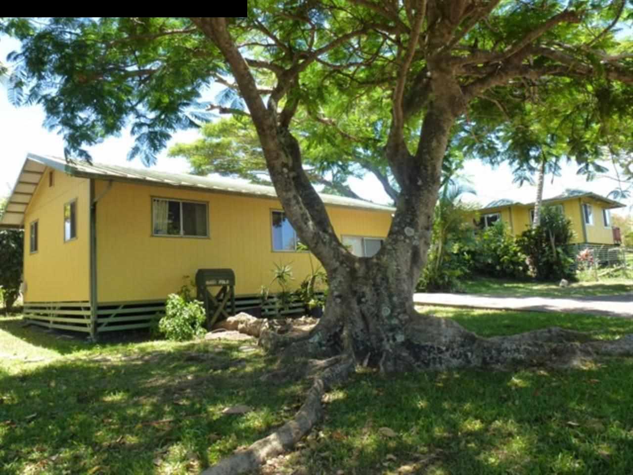 1220 West Kuiaha Road, Unit B1 Haiku, HI 96708 - Photo 23 of 29 a backyard of a house with lots of green space
