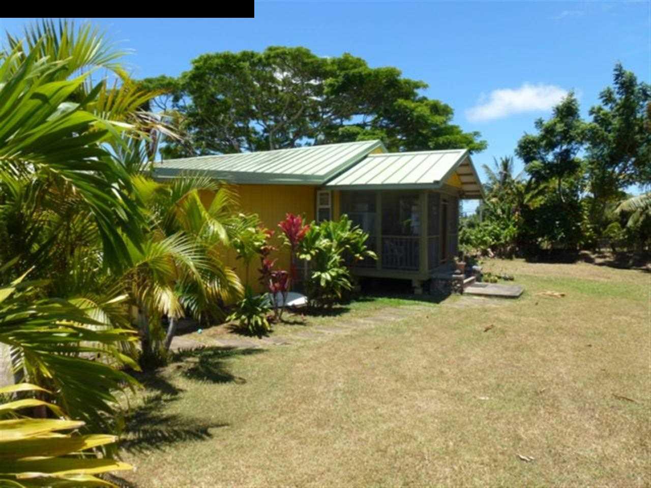 1220 West Kuiaha Road, Unit B1 Haiku, HI 96708 - Photo 26 of 29 a view of a house with a yard