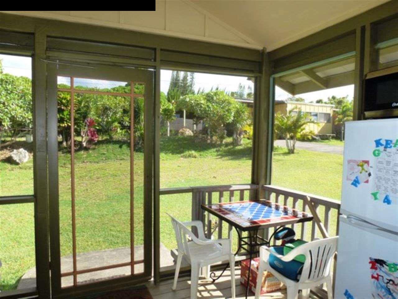 1220 West Kuiaha Road, Unit B1 Haiku, HI 96708 - Photo 29 of 29 a view of an outdoor dining space with furniture