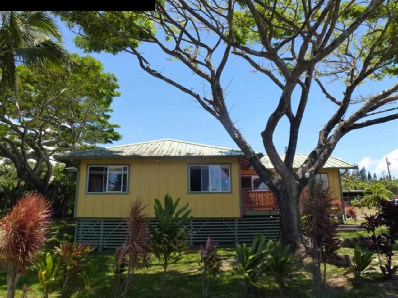1220 West Kuiaha Road, Unit B1 Haiku, HI 96708 - Photo 6 of 29 a house that has a tree in front of the house