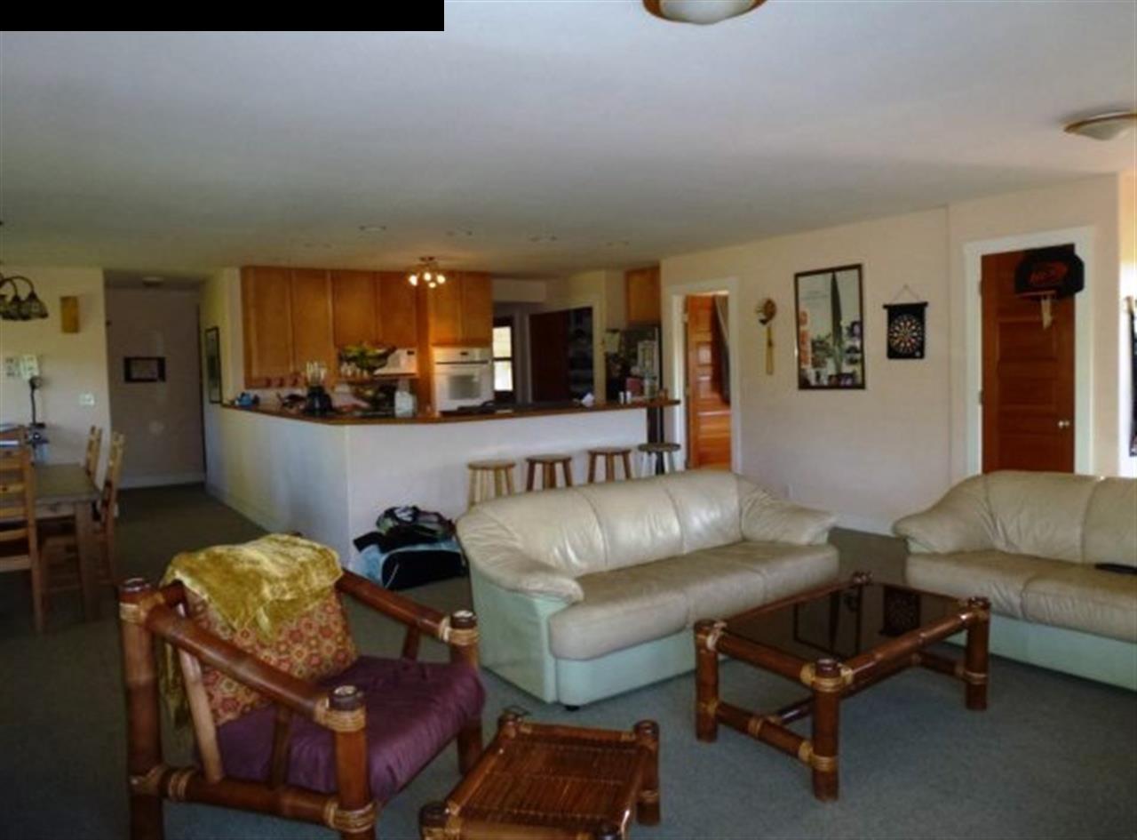 1220 West Kuiaha Road, Unit B1 Haiku, HI 96708 - Photo 9 of 29 a living room with furniture and a couch