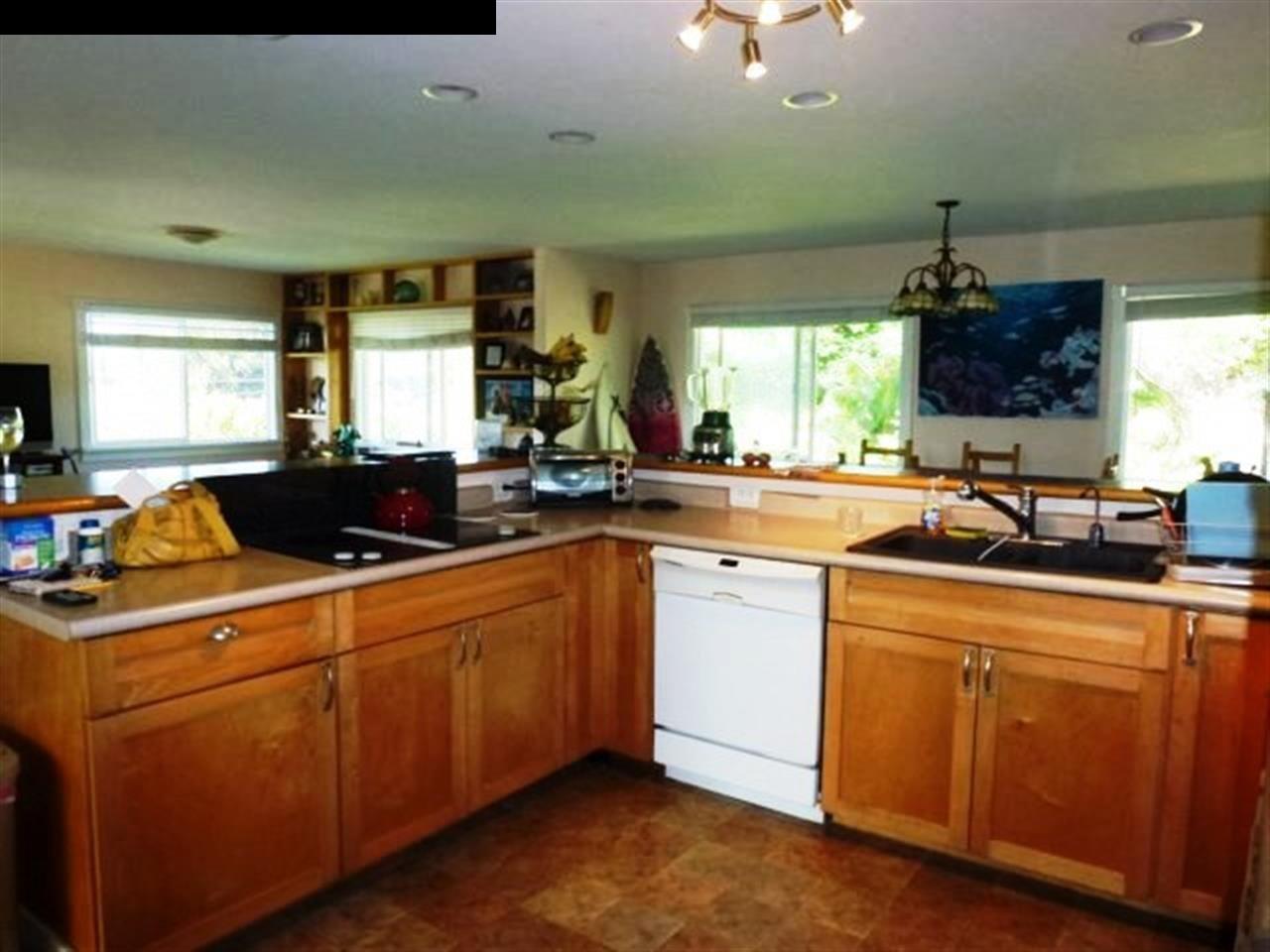 1220 West Kuiaha Road, Unit B1 Haiku, HI 96708 - Photo 10 of 29 a kitchen with a sink and cabinets