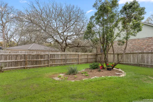 a view of a backyard with a garden