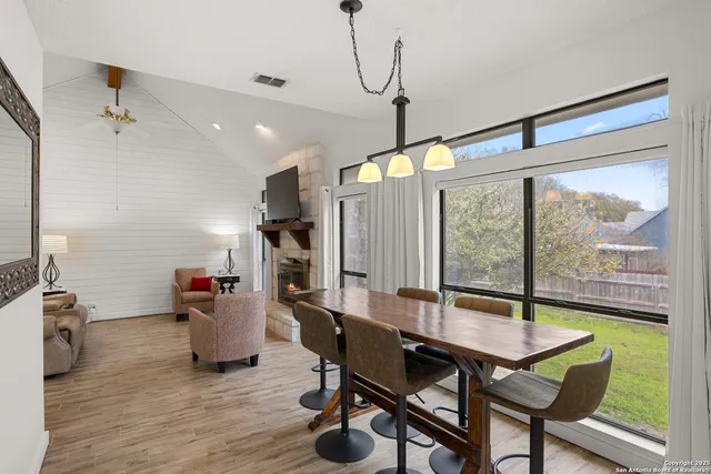 a view of a dining room with furniture window and wooden floor
