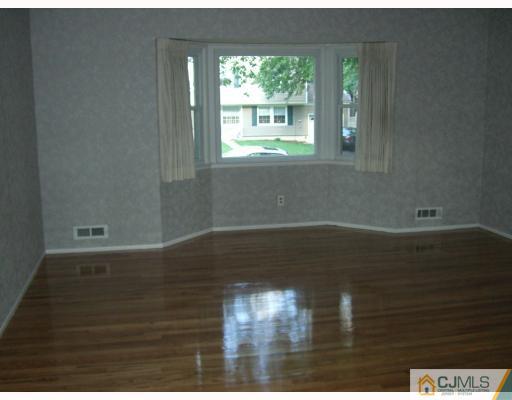 32 Phillips Road Edison, NJ 08817 - Photo 3 of 8 a view of empty room with wooden floor