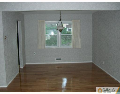 32 Phillips Road Edison, NJ 08817 - Photo 4 of 8 a view of wooden floor and windows in a room