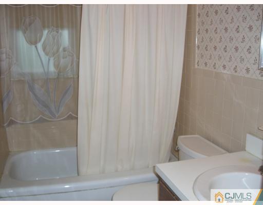 32 Phillips Road Edison, NJ 08817 - Photo 7 of 8 a bathroom with a toilet and shower