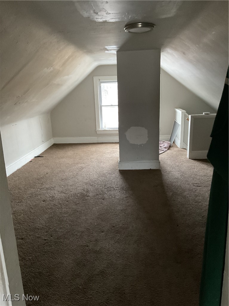 876 Paxton Road Cleveland, OH 44108 - Photo 22 of 26 Additional living space with carpet, vaulted ceiling, and baseboards