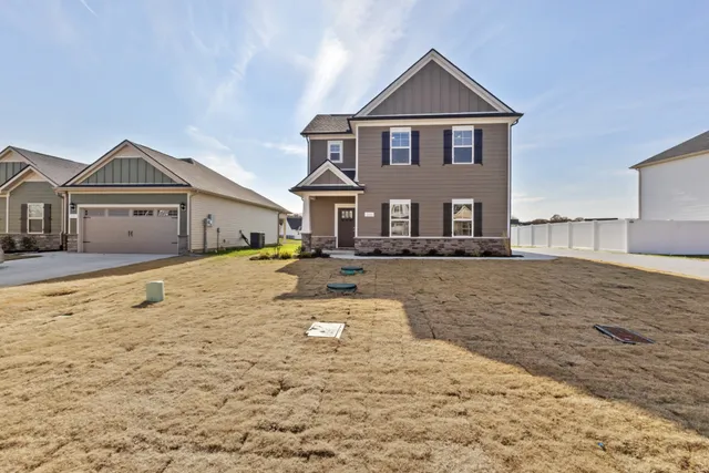 a front view of a house with a yard