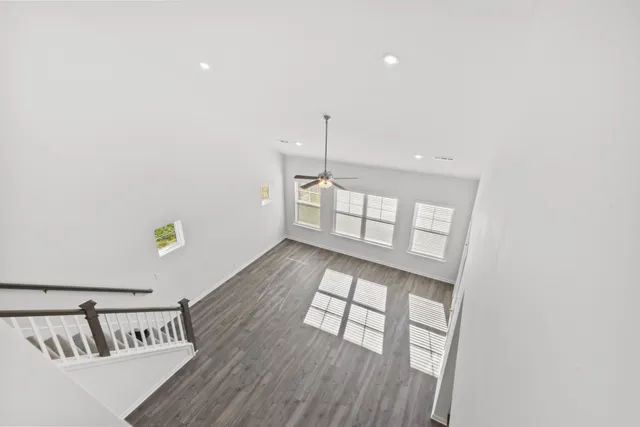 a view of an entryway with wooden floor