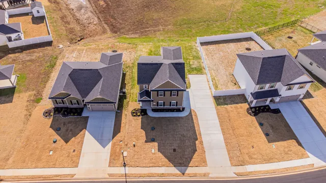 an aerial view of a house with wooden floor