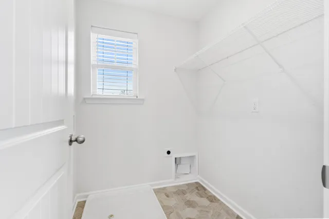 a bathroom with a bathtub and window